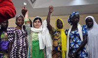 Pakistani education activist Malala Yousafzai poses with five escaped Chibok school girls – the Nigerian government has not done enough to help the others Photograph: Isaac Babatunde/AFP/Getty Images