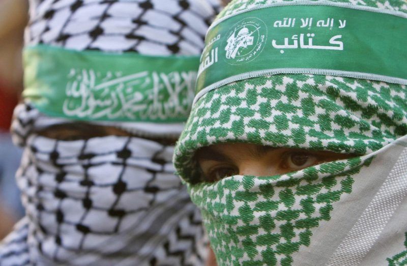 Masked Hamas supporters take part in a protest against against the Israeli offensive on Gaza strip, in the West Bank city of Nablus July 31, 2014. (Abed Omar Qusini/Reuters)