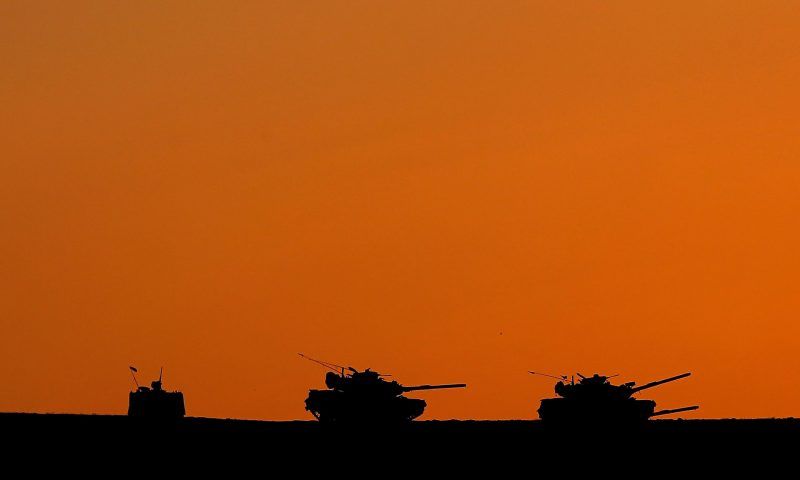 Turkish tanks on guard at the Turkey-Syria border. Photograph: Sedat Suna/EPA