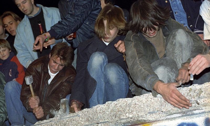 West Berliners chip away at the Berlin Wall in 1989. Photograph: EPA