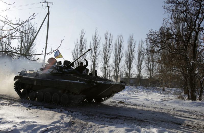 An Armoured Presonnel Carrier of the Ukrainian forces rolls in the village of Pisky, close to the airport of eastern Ukrainian city of Donetsk on December 3, 2014. (Anatolii Stepanov/AFP/Getty Images)