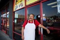 Jesús Miranda, a new commissioner of the South Gate Advisory Board, outside his restaurant, LAX Tacos, last week. Credit Emily Berl for The New York Times