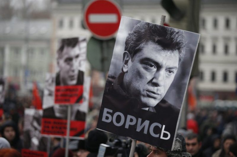 Portraits of the murdered opposition veteran Boris Nemtsov during a rally on Sunday in his memory, in Moscow. Credit Sergei Ilnitsky/European Pressphoto Agency