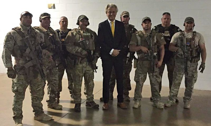Geert Wilders, the far-right Dutch politician, poses with police officers who responded to the shooting at Muhammad Art Exhibit in Dallas. Photograph: AP