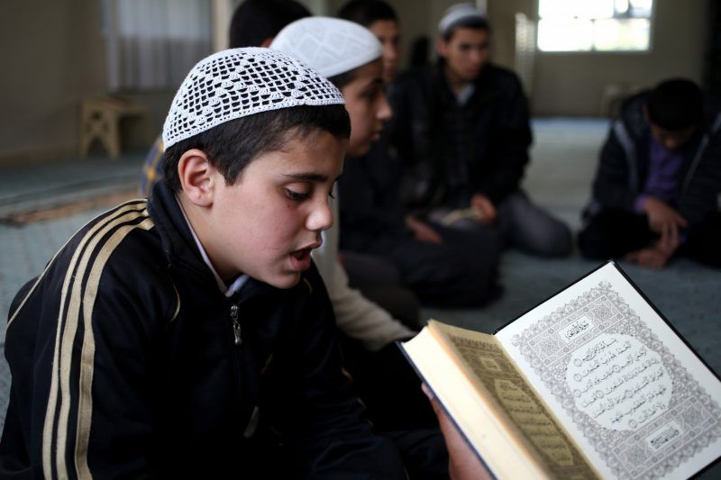 A Syrian boy in April recites verses from the Quran at a teaching center designed to counter Islamic State indoctrination. (Hussein Malla/Associated Press)