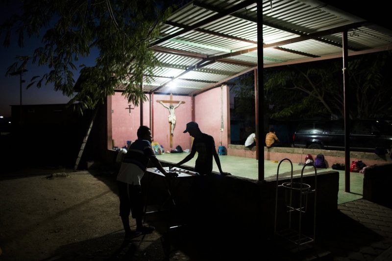 The shelter Hermanos en el Camino, which is used for sleeping at night and to escape the sun during the day, when people relax, play cards and hold church services on Sundays. Credit Katie Orlinsky for The New York Times 