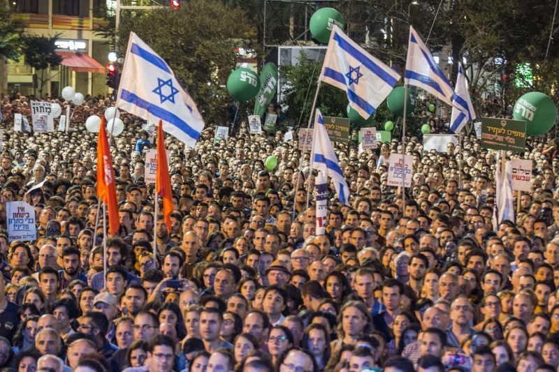 People attend a commemorative rally in memory of late Israeli prime minister Yitzhak Rabin at Rabin Square in Tel Aviv on Oct. 31. (Jack Guez/Agence France-Presse via Getty Images)