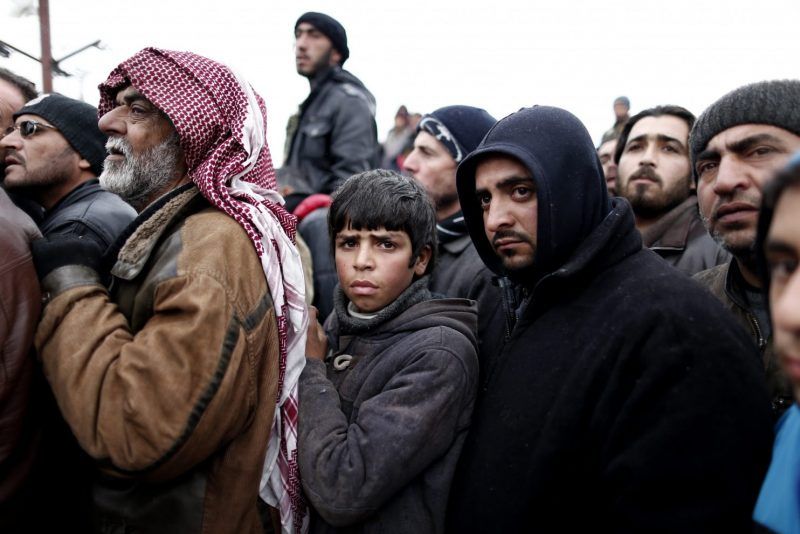 Syrian refugees wait for food near a refugee camp in Bab Al-Salama city in northern Syria, on Feb. 6. (Sedat Suna/European Pressphoto Agency