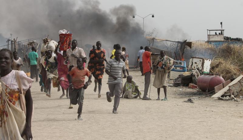 South Sudanese civilians flee fighting in an United Nations base in the northeastern town of Malakal on 18 February 2016. Photo by Getty Images.