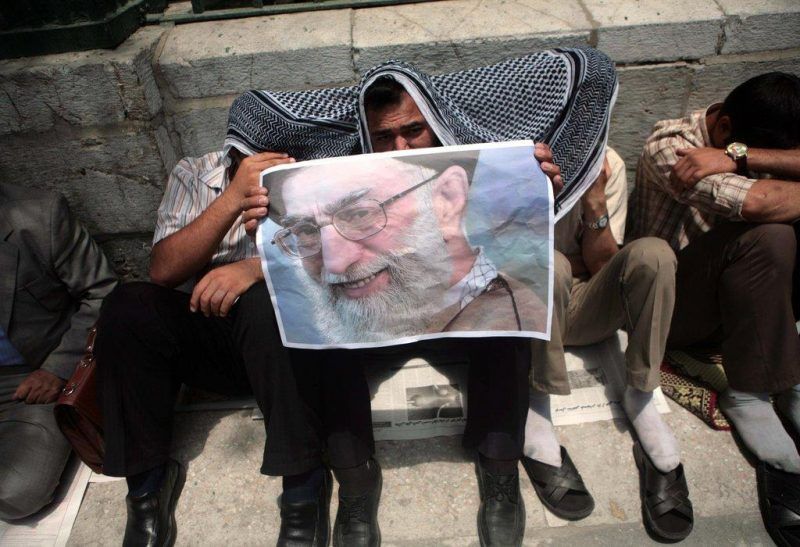 Iranians listened to a Friday prayer speech by Ayatollah Ali Khamenei in 2009. Newsha Tavakolian/Polaris, for The New York Times