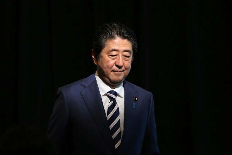 Prime Minister Shinzo Abe has unified Japan simply by promoting patriotic symbolism while protecting the welfare state. Rick Rycroft/Associated Press