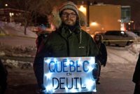 A sign stating “Quebec in mourning” at a rally near the Islamic Cultural Center in Quebec City last month. Credit Alice Chiche/Agence France-Presse — Getty Images