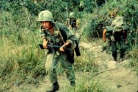 Soldiers moving through rough terrain searching for Viet Cong near Tuy Hoa, during Operation Harrison in 1966. Credit Robert C. Lafoon/U.S. Army, via National Archives