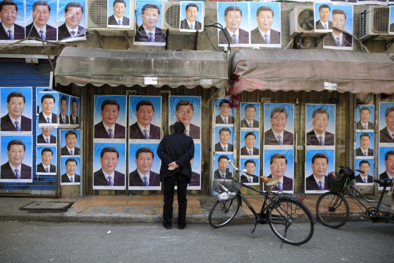 A building covered in posters of Chinese President Xi Jinping, Shanghai, China, March 26, 2016