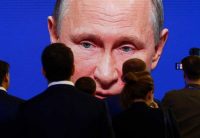 Participants of an economic forum in St. Petersburg, Russia, watching Vladimir Putin speak. Credit Sergei Karpukhin/Reuters