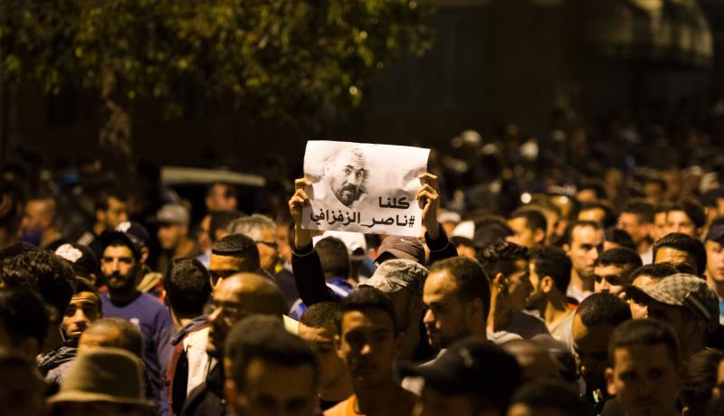 Protestors hold a picture of protest leader Nasser Zefzafi in Al Hoceima. Photo: Getty Images