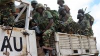 African Union troops move on the back of one of their trucks just outside of the Somalian capital Mogadishu, on 22 May 2012. Mohamed Abdiwahab / AFP