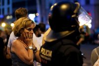 At least 13 people were killed and more than 100 wounded when a van plowed into a crowd in Barcelona on Thursday. Credit Pau Barrena/Agence France-Presse — Getty Images