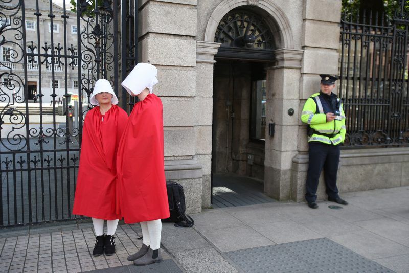 Niall Carson/AP Images. Reproductive rights activists, dressed as Handmaids from Margaret Atwood’s The Handmaid’s Tale, outside the Irish parliament before deliberation about the constitutional ban on abortion, September 18, 2017