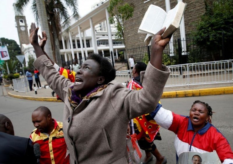Jubilee Party supporters cheer Nov. 20 in Nairobi after Kenya’s Supreme Court upheld the reelection of President Uhuru Kenyatta in last month’s repeat presidential vote. (Baz Ratner/TPX Images of the Day/Reuters)