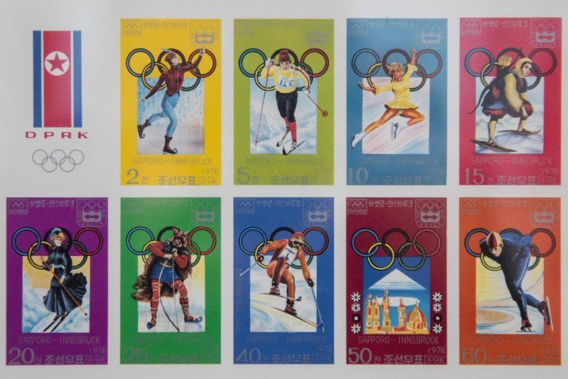 Stamps commemorating North Korea’s participation in past Winter Olympics were displayed in a shop in Pyongyang. The North has moved to reopen relations with South Korea, ostensibly because it wants to participate in the Games being hosted there next month. Credit Ed Jones/Agence France-Presse — Getty Images