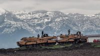 Turkish tanks are parked near the Syrian border at Hassa, in Turkey’s Hatay province, as part of the operation "Olive Branch", on 24 January 2018. AFP/Ozan Kose