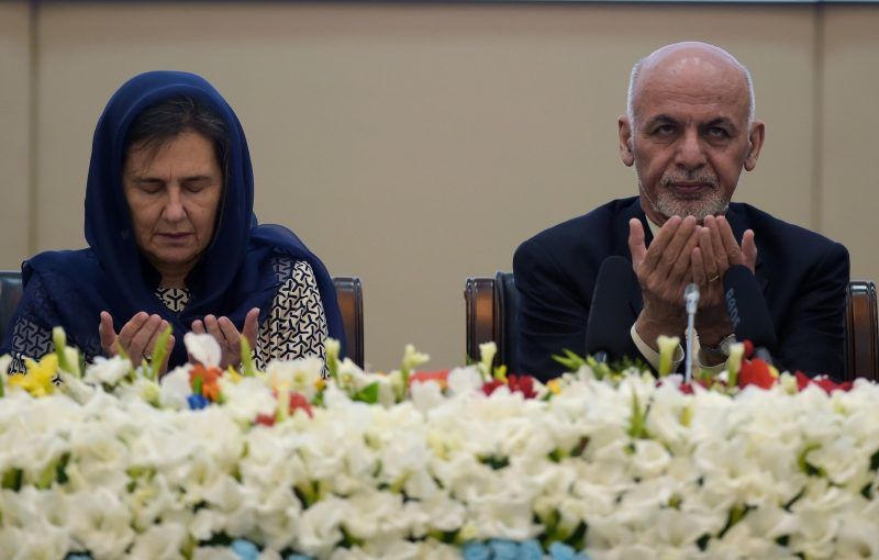 President Ashraf Ghani of Afghanistan, right, and the country’s first lady, Rula Ghani, left, pray during the Kabul Process conference at the Afghan presidential palace on Feb. 28. Credit Shah Marai/Agence France-Presse — Getty Images