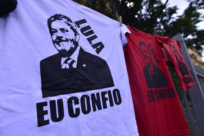 Demonstrators hold flags during a protest against the appeals court's decision to upheld a graft sentence against former President Luiz Inacio Lula da Silva in Sao Paulo, Brazil, on Wednesday, Jan. 24, 2018. All three judges voted to deny Lula his appeal against a criminal conviction for accepting an upgrade to a beach-side apartment along with other benefits from a construction company in exchange for favors. (Photo by Cris Faga/NurPhoto via Getty Images)