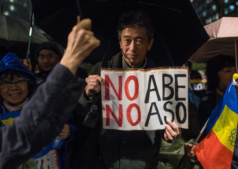 Protesters calling for the resignation of Prime Minister Shinzo Abe and his finance minister, Taro Aso, over a land sale scandal, Tokyo, Japan, March 16, 2018. Carl Court/Getty Images