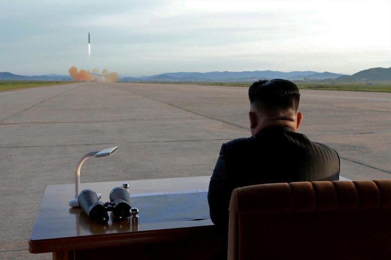 Kim watching a missile launch, March 2018. KCNA / REUTERS
