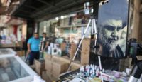 A Muqtada al-Sadr mobile phone cover for sale in a Baghdad market. Photo: Getty Images.