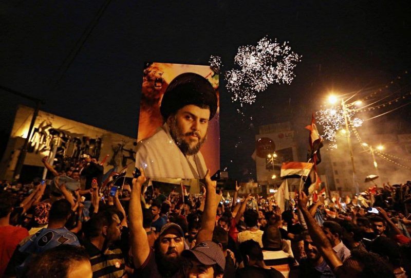 Supporters of Shiite cleric Moqtada al-Sadr celebrate their electoral success in Baghdad in May 2018. (Hadi Mizban/AP)