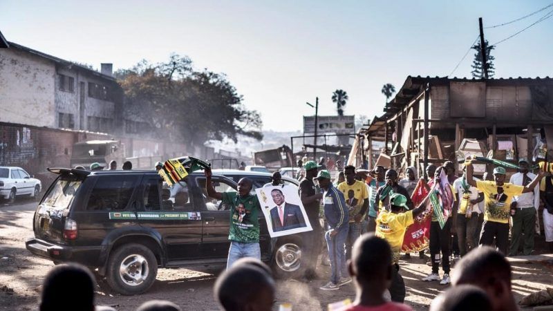 Supporters of the newly reelected Zimbabwe President Emmerson Mnangagwa celebrate in Mbare, Harare, on 3 August 2018. MARCO LONGARI / AFP