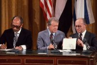 From left, President Anwar al-Sadat of Egypt, President Jimmy Carter and Prime Minister Menachem Begin signing the preliminary Camp David Accords in 1978. Credit Wally McNamee/Corbis, via Getty Images