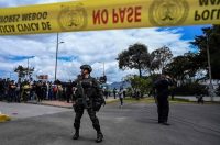 Colombian security forces stand guard at the site of an explosion at a police academy in Bogota on Jan. 17. Nine people were killed and more than 50 wounded in the car bomb attack. (AFP/Getty Images)