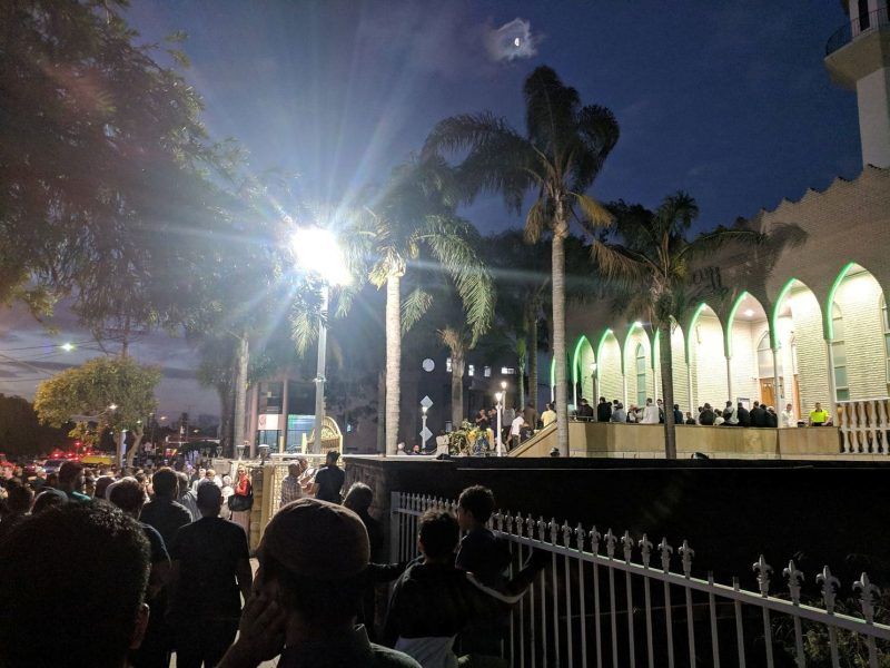 People gather at a vigil for Christchurch shooting victims at Lakemba Mosque in Sydney on Friday. (Tayyab Hameed/Reuters)