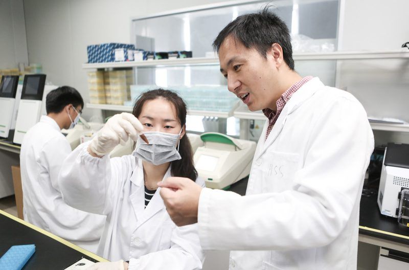 SHENZHEN, CHINA - AUGUST 04: Biological researcher He Jiankui (R) guides a laboratory staff member at the Direct Genomics lab on August 4, 2016 in Shenzhen, Guangdong Province of China. Biological researcher He Jiankui claimed to have created the world's first gene-edited twin baby girls 'Lulu' and 'Nana'. Twin baby girls 'Lulu' and 'Nana' were said to possess genetic alterations that could protect them from HIV. (Photo by VCG/VCG via Getty Images)