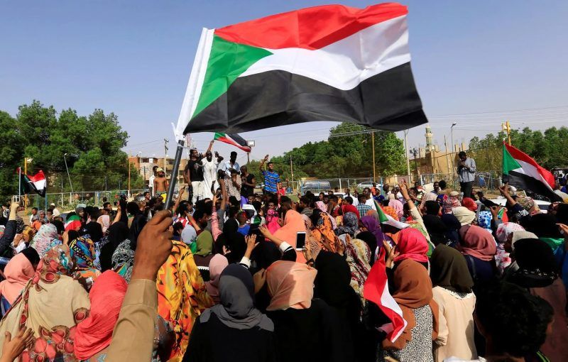 People celebrate in Khartoum on July 5 after Sudan’s ruling military council and a coalition of opposition and protest groups reached an agreement to share power leading up to elections. (Mohamed Nureldin Abdallah/Reuters)