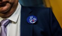 The button of a PiS supporter on election day. Photo: Getty Images.