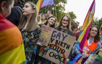 Attila Husejnow/SOPA Images/Light Rocket via Getty Images. Participants bearing placards during the pro-LGBT “Equality March” in Lublin, Poland, September 28, 2019