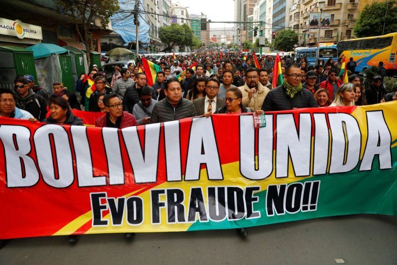 People march in La Paz Wednesday against Bolivia's president, Evo Morales, following the results of a contentious presidential election. (Kai Pfaffenbach/Reuters)