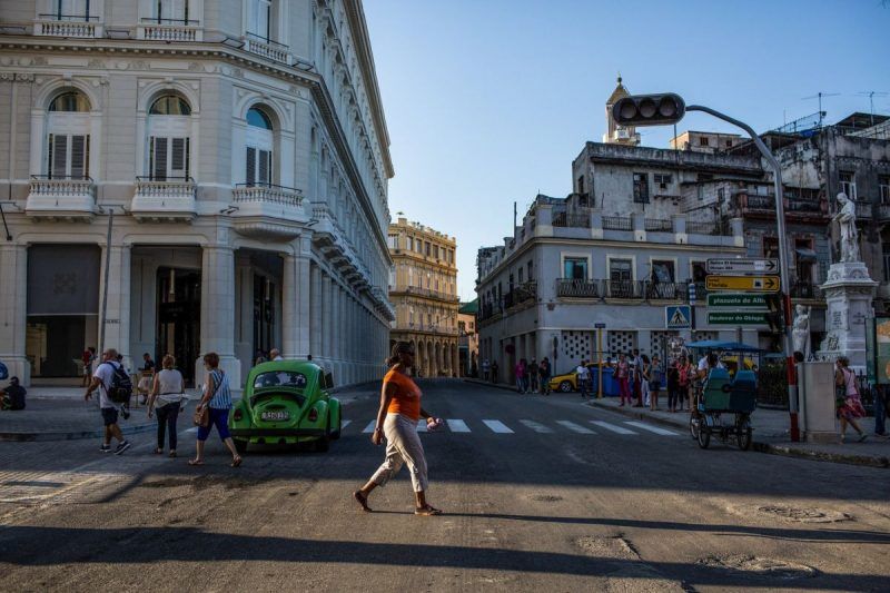 Pedestrians in Havana. Credit Lisette Poole for The New York Times