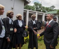 Reinstated Malawi Vice President Saulos Klaus Chilima, right, greets lawyers on Feb. 3 in Lilongwe. (Amos Gumulira/Afp Via Getty Images)
