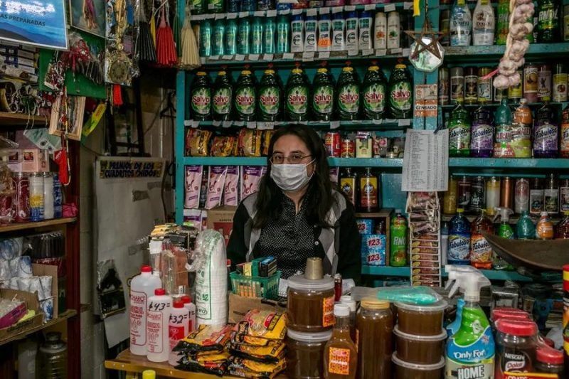 Claudia González is worried even though she sells items sought after during the pandemic, such as cleaning supplies. "The virus doesn’t scare us so much, but we’re very afraid for our business."