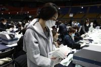 Officials from the South Korean Central Election Management Committee and election observers in Seoul count votes cast for the April 15 parliamentary election. (Chung Sung-Jun/Getty Images)