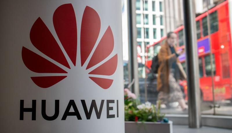 A pedestrian walks past a Huawei product stand at a telecommunications shop in central London on 29 April 2019. Photo: Getty Images. 