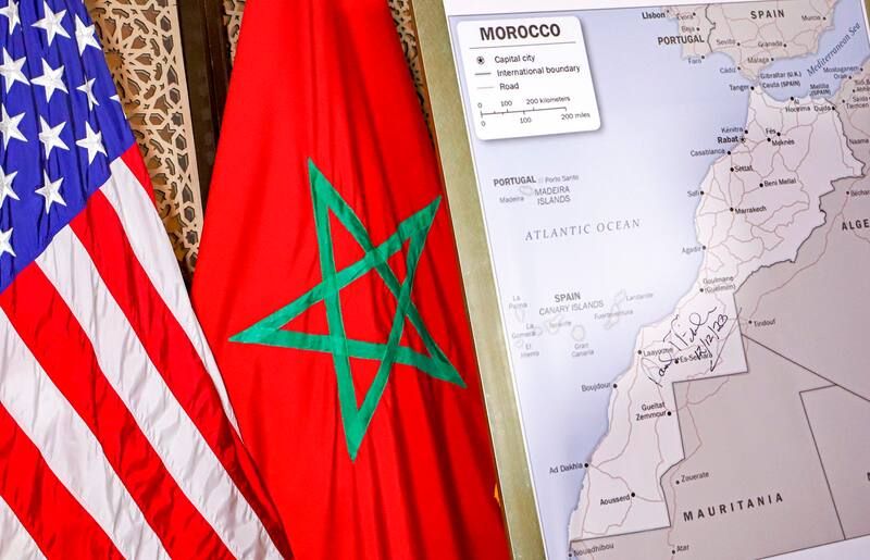 U.S. and Moroccan flags next to a map of Morocco recognizing the territory of Western Sahara. (Str/AFP/Getty Images)