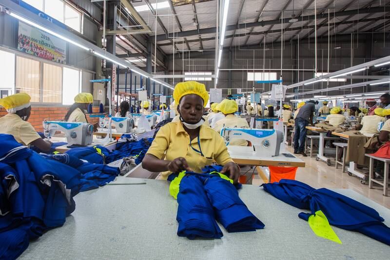 Employees at a Chinese-owned factory on the outskirts of Kigali, Rwanda, prepare polyester polo shirts for export on May 18, 2018. (Jacques Nkinzingabo for The Washington Post) 