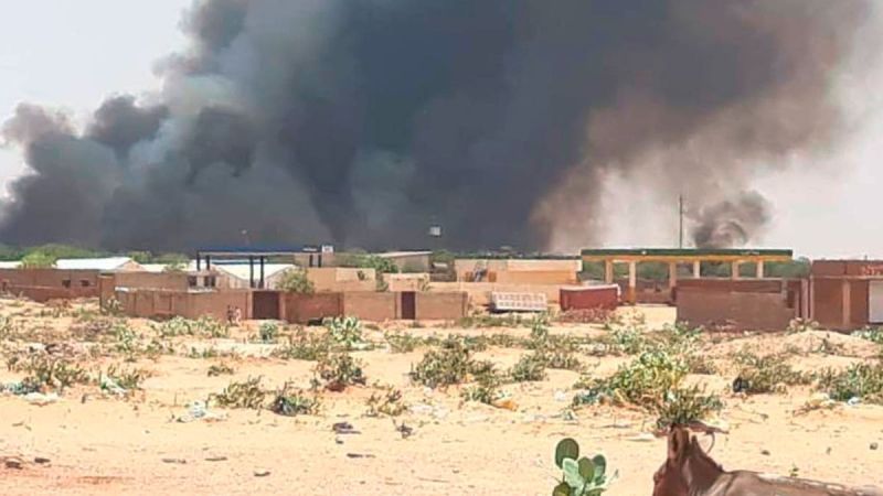 Smoke rises from Abu Zar camp for internally displaced persons in West Darfur, Sudan, on Tuesday, April 6, 2021. 