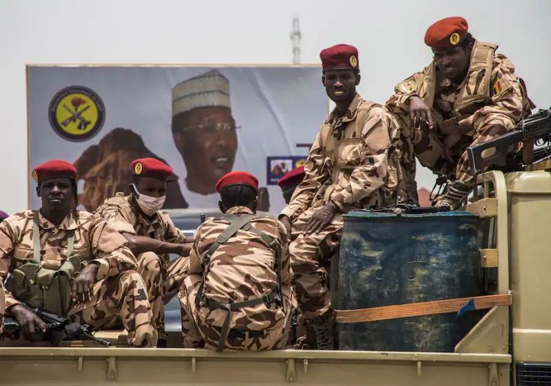 Soldiers sit in a truck in N’Djamena during the state funeral last month of Chad’s president. President Idriss Déby died of injuries suffered in clashes with rebels in the country’s north, an army spokesperson announced April 20. He had been in power since 1990. (Christophe Petit Tesson/Pool/AP) 
